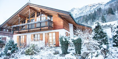 Hotels und Ferienwohnungen im Oberallgäu - Ausstattung: WLAN inklusive - Alpenhaus Oberstdorf - Außenansicht (Winter) - ALPENHAUS Oberstdorf