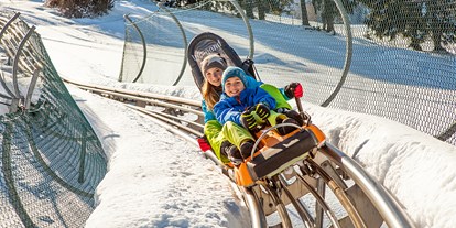 Hotels und Ferienwohnungen im Oberallgäu - Parken & Anreise: Busparkplatz - Oberallgäu - Alpsee Bergwelt mit Alpsee Coaster im Winter - Alpsee Bergwelt mit Alpsee Coaster im Winter