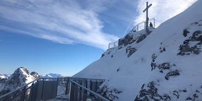 Hotels und Ferienwohnungen im Oberallgäu - Parken & Anreise: Anreise mit ÖPNV möglich - Bayern - Skigebiet Nebelhorn über Oberstdorf im Oberallgäu - Die Nebelhornbahn im Winter 