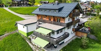 Hotels und Ferienwohnungen im Oberallgäu - Parken & Anreise: Anreise mit ÖPNV möglich - Außenaufnahme im Sommer | DAS KLEEMANNs - DAS KLEEMANNs - Urlaub erfrischend anders